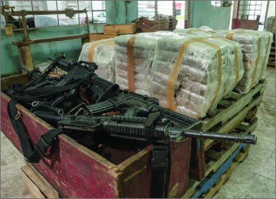 Red crate full of guns and drugs